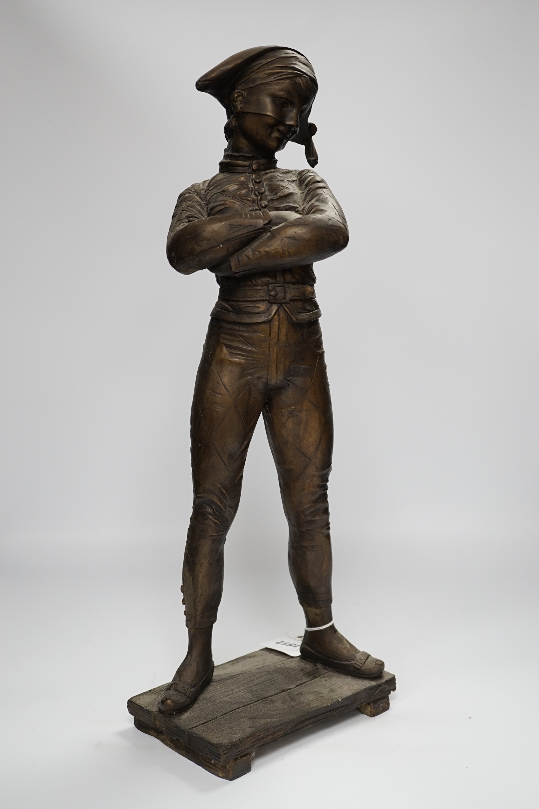 A tall bronze figure of harlequin, 52cm high